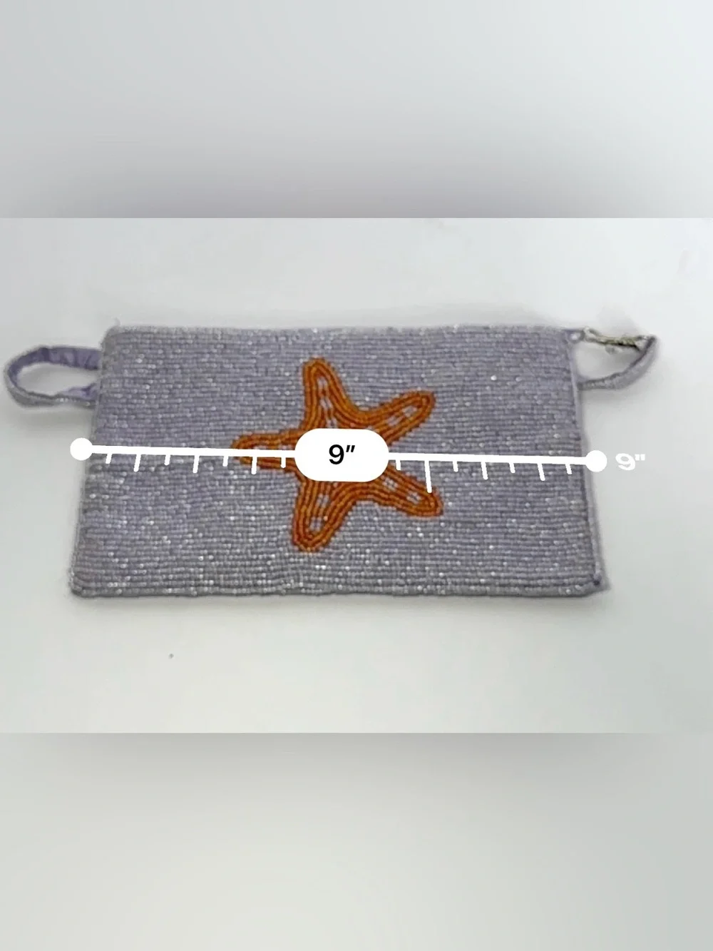Viral K.C. Malhan hand-beaded starfish wristlet clutch